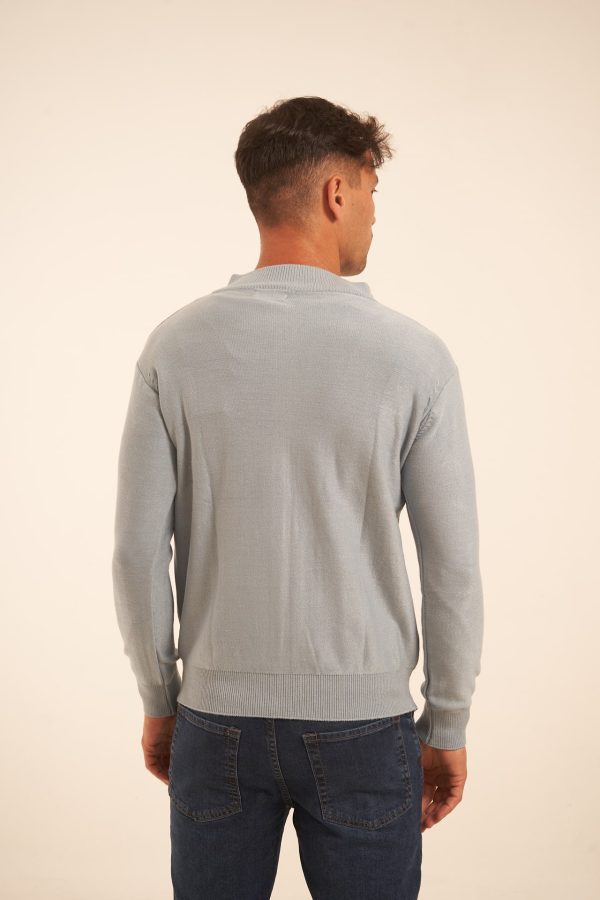 Campera tejida con cierre celeste