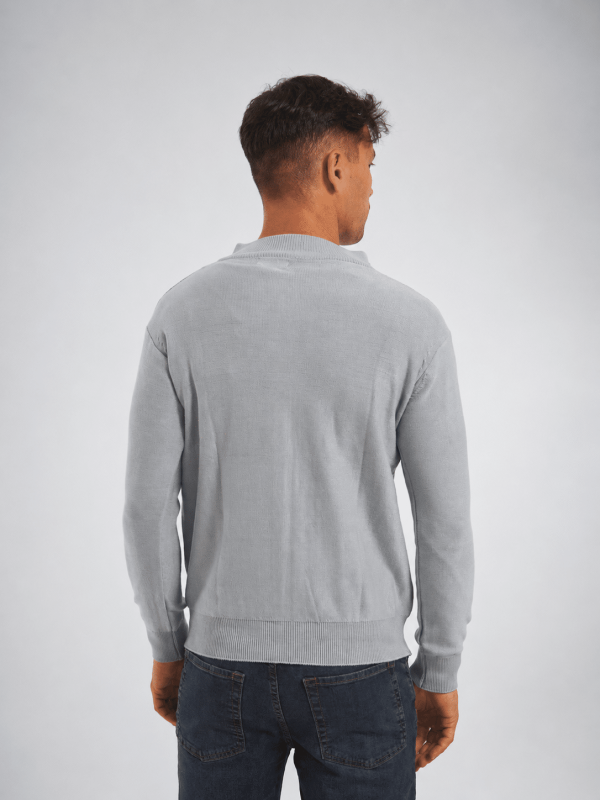 Campera tejida con cierre celeste