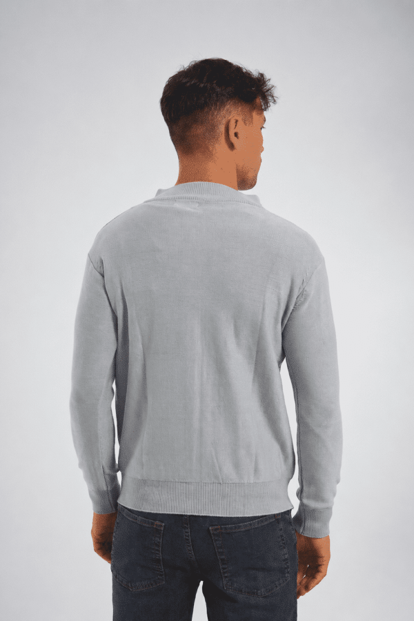 Campera tejida con cierre celeste